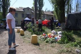 People brought flowers and toys to a house destroyed by a Russian missile