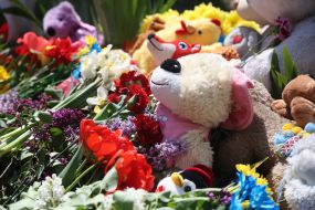 People brought flowers and toys to a house destroyed by a Russian missile