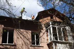 Emergency repair work near the house destroyed by a Russian missile
