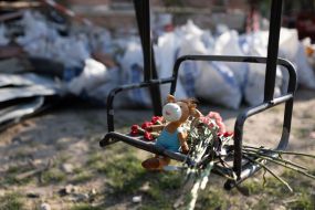 People brought flowers and toys to a house destroyed by a Russian missile