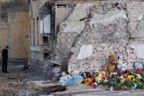 Volodymyr Zelenskyy near a house destroyed by a Russian missile in the Svyatoshynskyi district