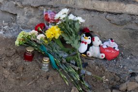 People brought flowers and toys to a house destroyed by a Russian missile