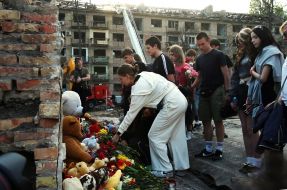 People brought flowers and toys to a house destroyed by a Russian missile