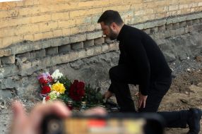 Volodymyr Zelenskyy near a house destroyed by a Russian missile in the Svyatoshynskyi district