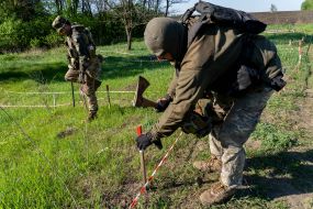 Police officers from the explosives disposal unit of the National Police of Ukraine are preparing to search for mines
