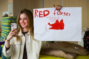 Cheerleader with a poster