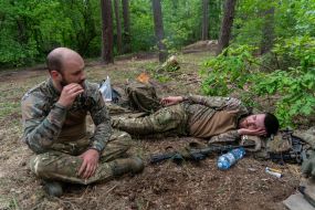 Soldiers resting after completing tasks