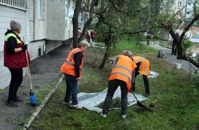 Municipal workers clean up after a massive combined attack on the city in the Obolonskyi district of Kyiv