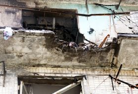 The charred facade of a residential building after being hit by a Russian drone "Geran-2" in the Obolonskyi district of Kyiv