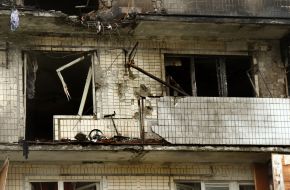 The charred facade of a residential building after being hit by a Russian drone "Geran-2" in the Obolonskyi district of Kyiv