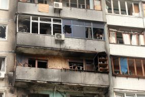 The charred facade of a residential building after being hit by a Russian drone "Geran-2" in the Obolonskyi district of Kyiv