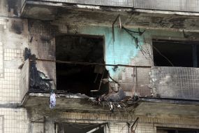 The charred facade of a residential building after being hit by a Russian drone "Geran-2" in the Obolonskyi district of Kyiv