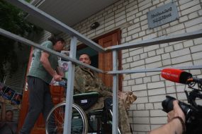 A prisoner of war from the second stage of the 1,000-for-1,000 exchange is brought to the hospital's reception department