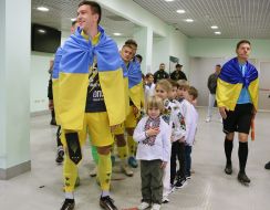 Referee and football players