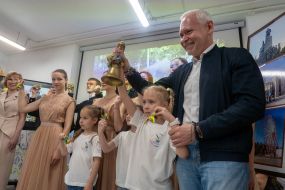 Igor Terekhov rings the bell with a schoolgirl