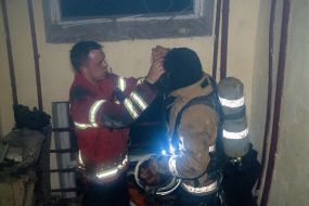 Rescuers work in a damaged residential building in Kharkiv