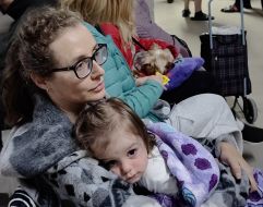 A woman and a little girl hide in a shelter of the NAU (now the Kyiv Aviation Institute) dormitory during a massive attack in Kyiv