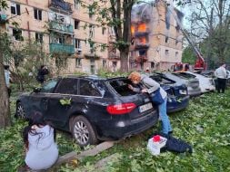 A destroyed entrance to a residential building as a result of a direct hit by a missile in the Solomianskyi district of Kyiv