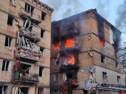 A destroyed entrance to a residential building as a result of a direct hit by a missile in the Solomianskyi district of Kyiv