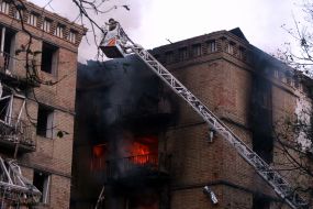 A destroyed entrance to a residential building as a result of a direct hit by a missile in the Solomianskyi district of Kyiv
