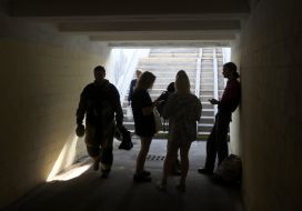 People hide in an underpass during a massive attack in the Solomianskyi district of Kyiv