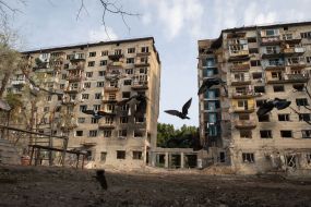 A destroyed entrance to a residential building as a result of a direct missile hit in the Solomianskyi district of Kyiv