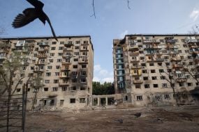 A destroyed entrance to a residential building as a result of a direct missile hit in the Solomianskyi district of Kyiv