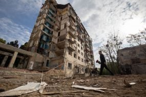 Volodymyr Zelenskyy at the site of the Russian attack on a residential building in the Solomianskyi district of Kyiv
