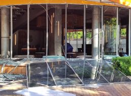 Completely shattered glass windows and doors in a building after a combined attack in the Shevchenkivskyi district of Kyiv
