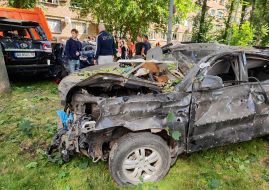 Burnt-out car after a combined attack in the Shevchenkivskyi district of Kyiv
