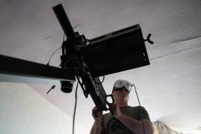 Military personnel train to shoot down aerial targets on a special simulator