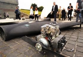 Conference participants examine fragments of Russian UAVs