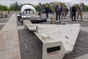 Conference participants examine fragments of Russian UAVs