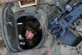 Paratroopers train in driving and firing from the Stryker armored personnel carrier at the training ground