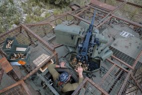 Paratroopers train in driving and firing from the Stryker armored personnel carrier at the training ground