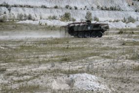 Paratroopers train in driving and firing from the Stryker armored personnel carrier at the training ground