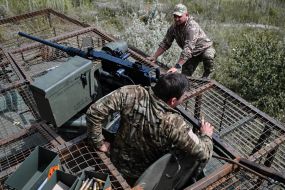 Paratroopers train in driving and firing from the Stryker armored personnel carrier at the training ground