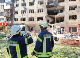 Rescuers near a residential building damaged by a Russian drone strike in the Sviatoshynskyi district of Kyiv