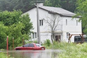 Flooded house in the village of Zubra, Lviv region
