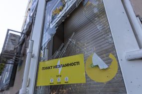 Broken glass in the door of the Point of Indestructibility after a drone hit part of a residential building in Odessa