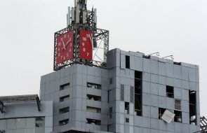 Damaged facade of a shopping center building