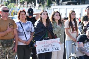 People honor the memory of fallen servicemen of the Airborne Assault Troops of the Armed Forces of Ukraine on a street in Lviv
