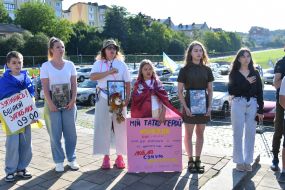 People honor the memory of fallen servicemen of the Airborne Assault Troops of the Armed Forces of Ukraine on a street in Lviv