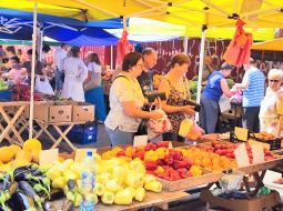 People buy vegetables at the market
