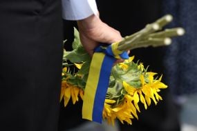 Flowers with yellow and blue ribbon