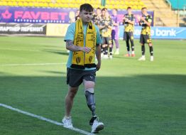 The military officer makes a symbolic kick on the ball