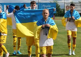 Football players with flags of Ukraine