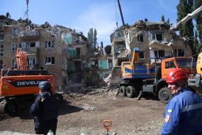 Rescuers continue search and rescue operations in the ruins of a five-story residential building after nighttime shelling in the Darnytskyi district of Kyiv