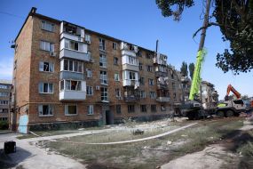 Rescuers continue search and rescue operations in the ruins of a five-story residential building after nighttime shelling in the Darnytskyi district of Kyiv