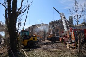 Rescuers continue search and rescue operations in the ruins of a five-story residential building after nighttime shelling in the Darnytskyi district of Kyiv